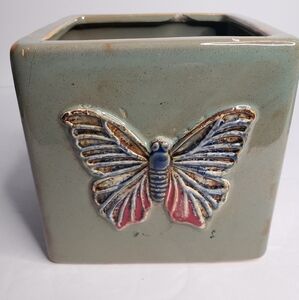 Square ceramic planter featuring a butterfly. 196